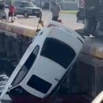 When a Car in Jaddaf Falls off a Pier, Two Young Men Escape Death