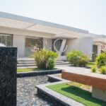 Luxury garden with a fountain and green bushes