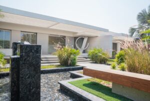 Luxury garden with a fountain and green bushes