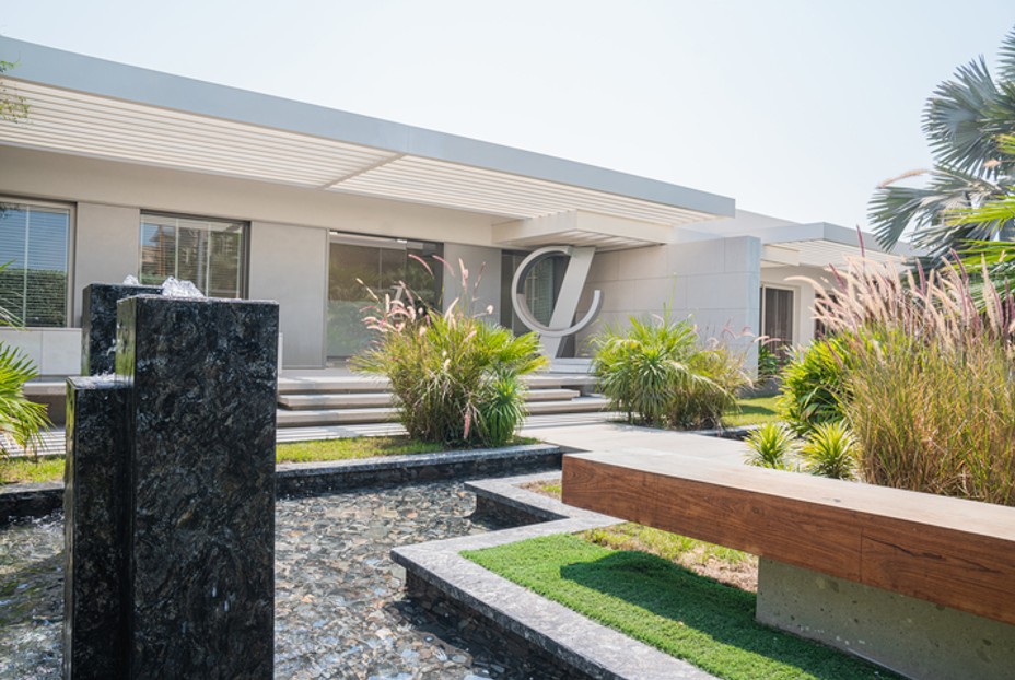 Luxury garden with a fountain and green bushes