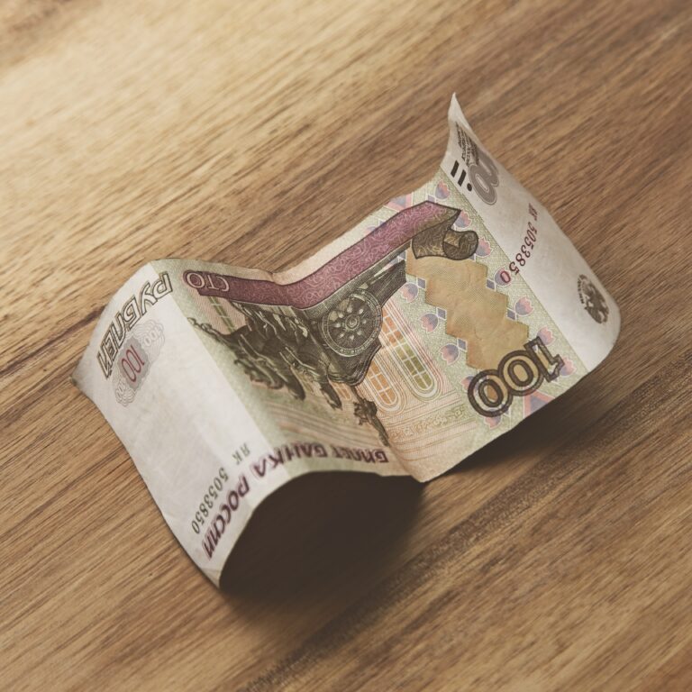 High angle closeup shot of a banknote on a wooden surface