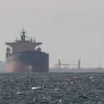 FILE PHOTO: Cargo ships in the Gulf, near the Strait of Hormuz